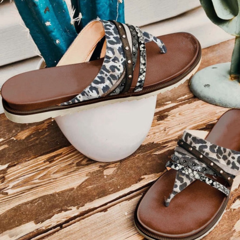Leopard print sandals with a rubber sole and leather upper. $20